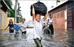  ?? HONG MENEA ?? Flooding in Phnom Penh’s Boeung Tompun commune last year.