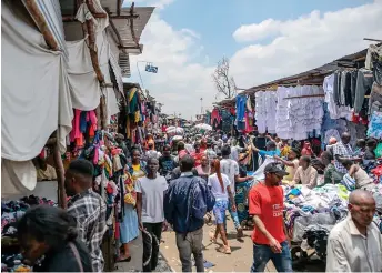  ?? ?? People shop at the second-hand clothes section of Gikomba Market in Nairobi.