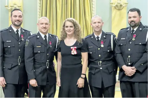  ?? SGT. JOHANIE MAHEU/ RIDEAU HALL ?? Constables Allan Rivet, Daniel Bassi, Jacob Braun and Neal Ridley wear their medals, the Decoration of Bravery, they received from Gov. Gen. Julie Payette at Rideau Hall in Ottawa Thursday.