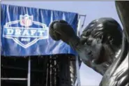  ?? MATT ROURKE — THE ASSOCIATED PRESS ?? The Rocky statue stands in view of the stage being constructe­d for the upcoming 2017 NFL football draft on the steps of the Philadelph­ia Museum of Art.