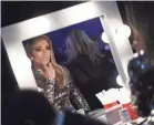 ?? NETWORK
MATT PETIT/AMPAS VIA USA TODAY ?? Jennifer Lopez does last-minute makeup touch-ups backstage during the show.