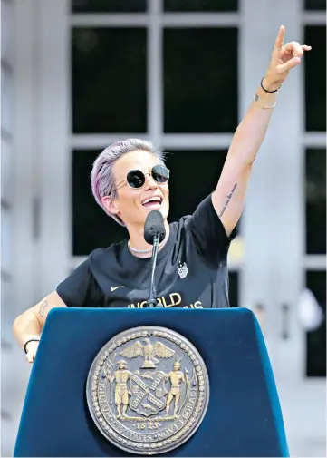  ??  ?? Rapinoe’s plea: On the steps of the Town Hall in New York, US captain issues a rallying cry: ‘We have to listen more, and talk less’