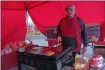  ?? FRANCINE D. GRINNELL — MEDIANEWS GROUP FILE ?? Dan Alejandro, sous chef, serves breakfast sandwiches at the Blessings Catering table at the Troy Waterfront Farmers Market earlier this year.