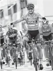  ?? Christophe Ena / Associated Press ?? Slovakia’s Peter Sagan leads the charge across the finish line Wednesday in Quimper, France.