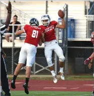  ?? RECORDER PHOTO BY CHIEKO HARA ?? East’s Robert Jimenez, right, celebrates with Bobby Chavez after scoring team’s first touchdown Saturday, during the 50th annual East vs West Tulareking­s All-star Football game at Visalia Community Stadium in Visalia. East lost 13-14.