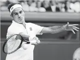  ?? ALASTAIR GRANT THE ASSOCIATED PRESS ?? Switzerlan­d’s Roger Federer hopes Wimbledon is his 21st Grand Slam title. He turns 38 on Aug. 8.