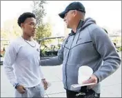  ?? Al Seib Los Angeles Times ?? CLAY HELTON, USC’s football coach, greets Amonra St. Brown as he moves into his dorm for summer.