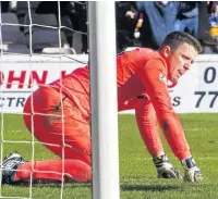  ??  ?? HOWLER Stunned Hearts keeper Colin Doyle after the goal