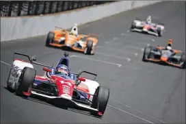  ?? CHRIS GRAYTHEN / GETTY IMAGES ?? A.J. Foyt Racing’s Takuma Sato (14) finished the Indy 500 in 13th place despite a first-lap collision with Chip Ganassi Racing’s Sage Karam.“I could do nothing. ... I was sandwiched between him and the wall,”Sato said of the incident.