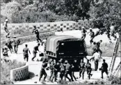  ??  ?? North Korean soldiers attack UN Command personnel at the truce village of Panmunjom, South Korea, in 1976. Two American soldiers were hacked to death by axe-wielding North Korean soldiers at the Korean Demilitari­zed Zone that bisects the two Koreas.