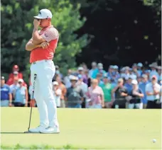  ?? ASSOCIATED PRESS ?? Gary Woodland reacts after missing a putt on the fifth green during the second round Friday.