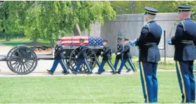  ?? MATT BUTTON/BALTIMORE SUN MEDIA GROUP ?? Members of the 3rd U.S. Infantry Regiment escort the caisson bearing the casket of Staff Sgt. Mark De Alencar during his funeral service at Arlington National Cemetery.