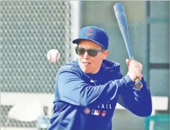  ?? ASSOCIATED PRESS FILE PHOTO ?? Chicago Cubs minor league hitting coach Rachel Folden hits an infield ground ball during spring training Feb. 5 in Mesa, Ariz.