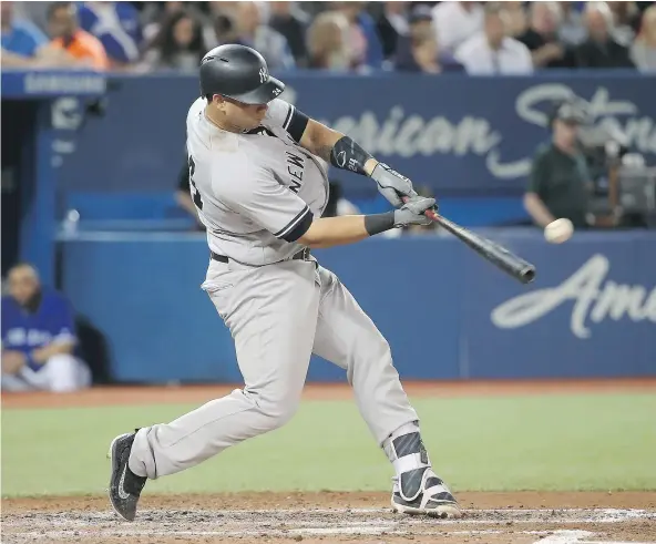 ?? — GETTY IMAGES ?? New York Yankees catcher Gary Sanchez hit a two-run home run in the fourth inning, his second of the game off Toronto Blue Jays starting pitcher Marco Estrada, as the Yankees cruised to a 12-2 blowout victory at Rogers Centre Thursday night.