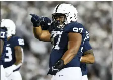  ?? BARRY REEGER - THE ASSOCIATED PRESS ?? Penn State defensive tackle PJ Mustipher is pointing to a victory over Michigan State in his final home game Saturday at Beaver Stadium.