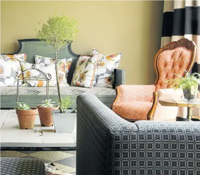  ??  ?? Classic with a twist: the Queen Anne chairs in the living room are upholstere­d in shweshwe fabric.