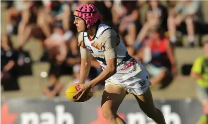  ?? Photograph: Will Russell/AFL Photos/Getty Images ?? Heather Anderson sports her distinctiv­e pink helmet during an Adelaide Crows’ game in 2017.