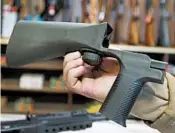  ?? GEORGE FREY/GETTY 2017 ?? Texas-based Slide Fire Solutions will stop taking orders for bump stocks at midnight May 20 and shutter its website.