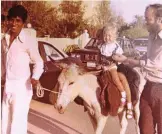  ??  ?? Birthday treat: Jawad leads as Lois and Matthew enjoy a donkey ride