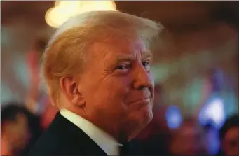  ?? REBECCA BLACKWELL — THE ASSOCIATED PRESS ?? Former President Donald Trump smiles toward guests, as he arrives to speak at an event at Mar-a-Lago. He’s leading in many 2024 polls.