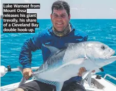  ?? ?? Luke Warnest from Mount Ossa releases his giant trevally, his share of a Cleveland Bay double hook-up.