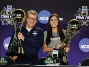  ?? The Associated Press ?? WOMEN’S WARE: Connecticu­t’s Geno Auriemma, left, is named coach of the year and Washington’s Kelsey Plum player of the year at the NCAA women’s Final Four basketball tournament Thursday in Dallas. Auriemma’s UConn Huskies, winners of 111 straight...