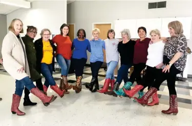  ??  ?? The Starkville Steppers model the 16 pairs of Ariat cowboy boots donated by a boot store in Mountain View, Arkansas after the owner saw the group perform while she was visiting her mother at Montgomery Gardens. (Submitted photo)