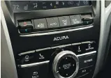  ??  ?? Fans of old-school buttons (as opposed to touchscree­ns) will appreciate the TLX’s controls.