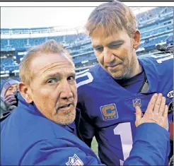  ?? AP ?? ME AND MY GUY: Interim head coach Steve Spagnuolo specifical­ly requested this photo of Eli Manning and him coming off the field Sunday after the Giants’ 18-10 season-finale win over the Redskins.