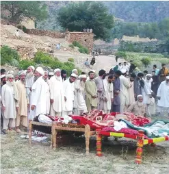  ??  ?? Pakistani mourners gather for the funeral prayers of victims of a suicide bombing in Bajaur Agency near the Pakistan-Afghanista­n border yesterday a day after suicide bombing at a mosque in the Mohmand tribal district. — AFP