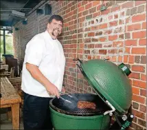  ??  ?? Kevin Rathbun grilling on the XL Big Green Egg at Kevin Rathbun Steak.