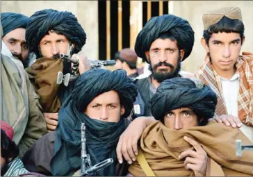  ?? AFP ?? Afghan Taliban fighters attend a meeting at Bakwah in the western province of Farah in 2015.