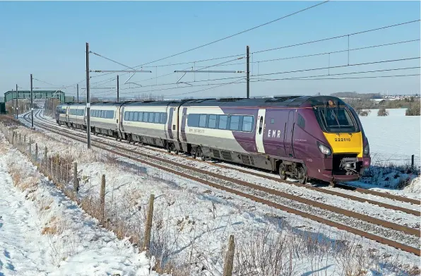  ??  ?? EMR-liveried ‘Meridian’ No. 222010 speeds south at a wintry Wymington (Bedfordshi­re) on January 25 with the 1C37/11.00 Sheffield-St Pancras. Note the cab front number is off-centre and in a heavier typeface than normal. Richard Gennis