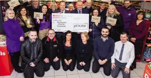 ?? PHOTOS: BRIDGE 19-40 UNION CANAL SOCIETY ?? Representa­tives of the Bridge 19-40 Canal Society join other charities at Spar Coatbridge to receive their awards.
