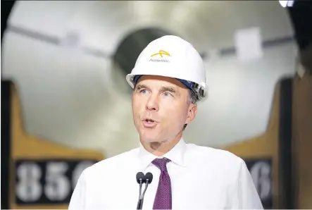  ?? PETER POWER/ THE CANADIAN PRESS ?? Finance Minister Bill Morneau announces a 15-day consultati­on period on whether to apply immediate provisiona­l safeguards on certain steel imports after touring one of ArcelorMit­tal Dofasco’s steel mills in Hamilton, Ont., on Tuesday,