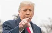  ?? ANDREW HARNIK/AP ?? President Donald Trump calls on a reporter outside the White House on Monday.