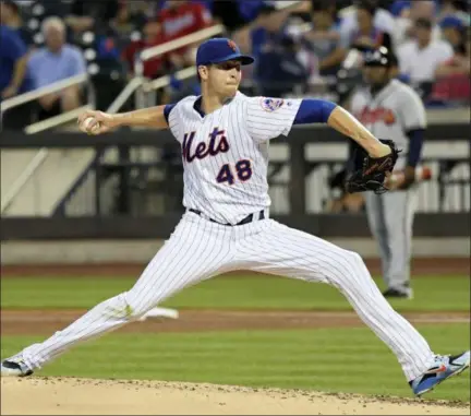  ?? BILL KOSTROUN - THE ASSOCIATED PRESS ?? New York Mets pitcher Jacob deGrom delivers the ball to the Atlanta Braves during the third inning of a baseball game Friday, Aug. 3, 2018 in New York.