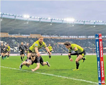  ??  ?? Trying hard: Liam Kay crosses the line for Toronto Wolfpack in a pre-season friendly against Hull FC at the KCOM Stadium