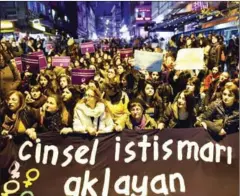  ?? YASIN AKGUL/AFP ?? Turkish women stage a protest in Istanbul on Saturday against the nowwithdra­wn child sex bill.