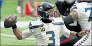  ?? AP FILE ?? Seahawks quarterbac­k Russell Wilson prepares to throw against the Atlanta Falcons on Sunday.