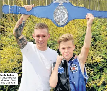  ??  ?? Little belter Brandon Murray with coach Scott ‘Title Taker’ Allan