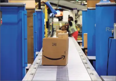  ?? Brian Cassella / Tribune News Service ?? Amazon is offering $500 signing bonuses for seasonal workers in Connecticu­t heading into the 2021 holiday season, on top of pay of up to $18.25 an hour.