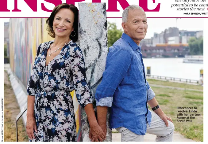  ??  ?? Difference­s to resolve: Linda with her partner Ronny at the Berlin Wall