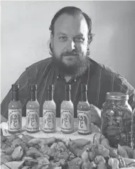  ?? SUBMITTED PHOTO ?? Matt Cook makes Cranky Dragons’ Hot Sauce.