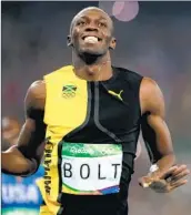  ?? Lee Jin-man Associated Press ?? AT THE 2016 Summer Olympics, Jamaica’s Usain Bolt became the first man to win three consecutiv­e 100-meter dashes. He edged Justin Gatlin of the U.S.