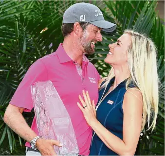  ??  ?? Happy day: Webb Simpson celebratin­g with his wife Taylor Dowd after winning The Players Championsh­ip at the TPC Sawgrass on Sunday. — Reuters