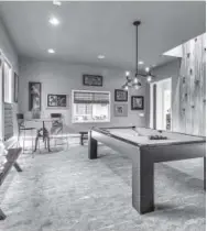  ??  ?? A pool table and climbing wall in a luxury home in Oklahoma. Provided by Authentic Custom Homes