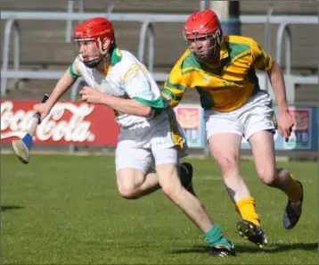  ??  ?? Blackwater sharpshoot­er Michael Lillis on the move towards the Rathgarogu­e-Cushinstow­n goal.