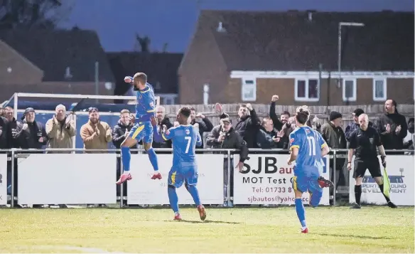  ?? ?? Josh McCammon celebrates his goal for Peterborou­gh Sports against Alvechurch in front of the home fans. Photo: James Richardson