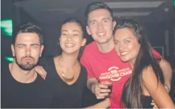  ??  ?? Mia Ayliffe Chung, second left, with friend Chris Porter (third from left) socialisin­g with partygoers in Surfers Paradise before their fateful trip to Home Hill in North Queensland in August last year.